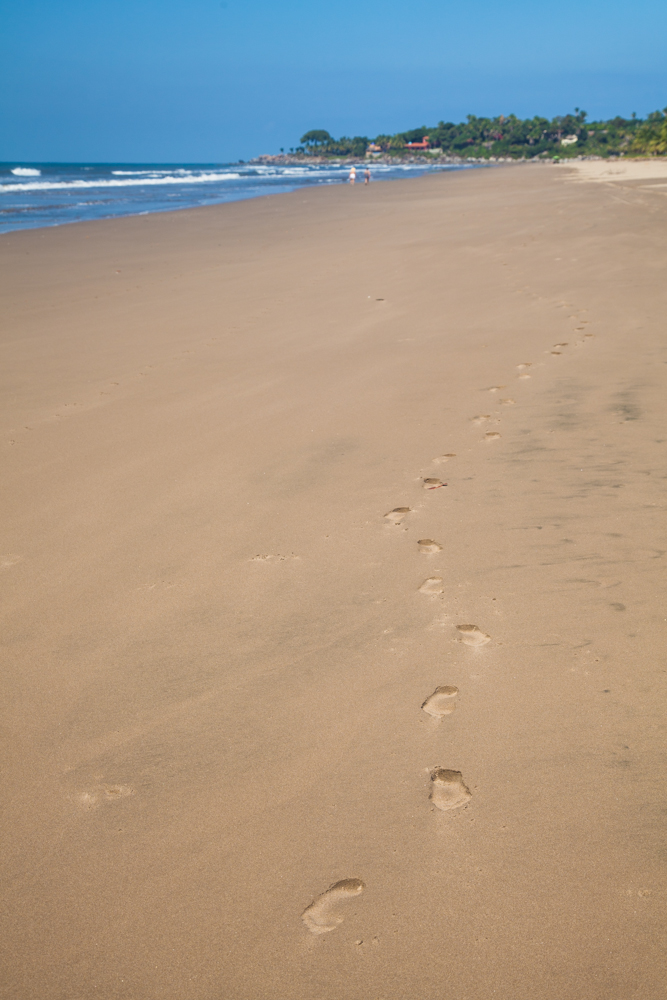 footprints in whit sand beach
