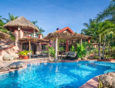 Luxury villa Las Mañanitas with private pool surrounded by lush greenery at Playa Las Tortugas, Mexico.